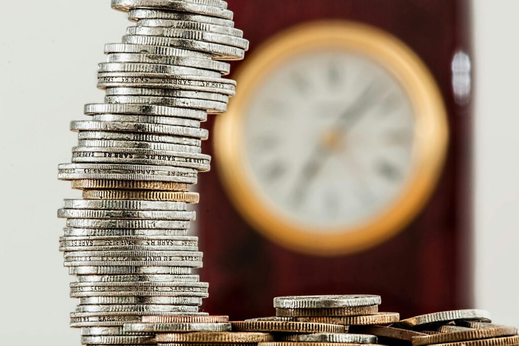 selective focus photo of stacked coins